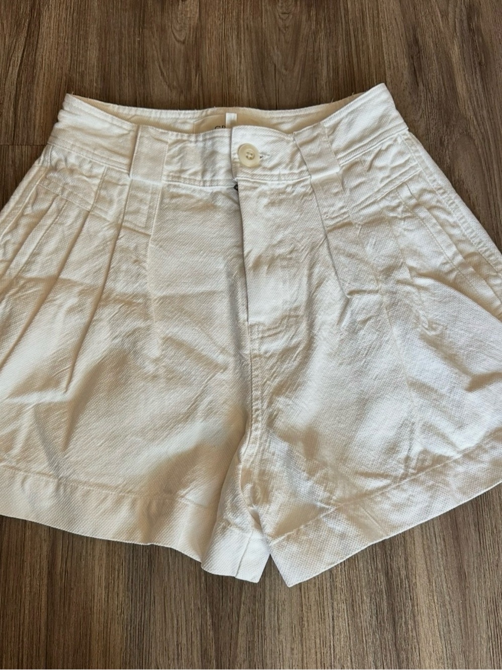 THE GREAT. Off-White High-Waist Pleated Shorts